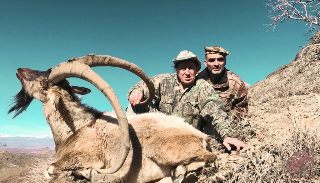Ibex hunting in the mountains of Iran – hunters with a large-horn trophy, hunt in Iran adventure.