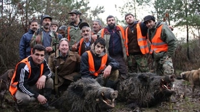 Hard work, dedication, and respect for the tradition. two magnificent Wild Boar with the hunting family.